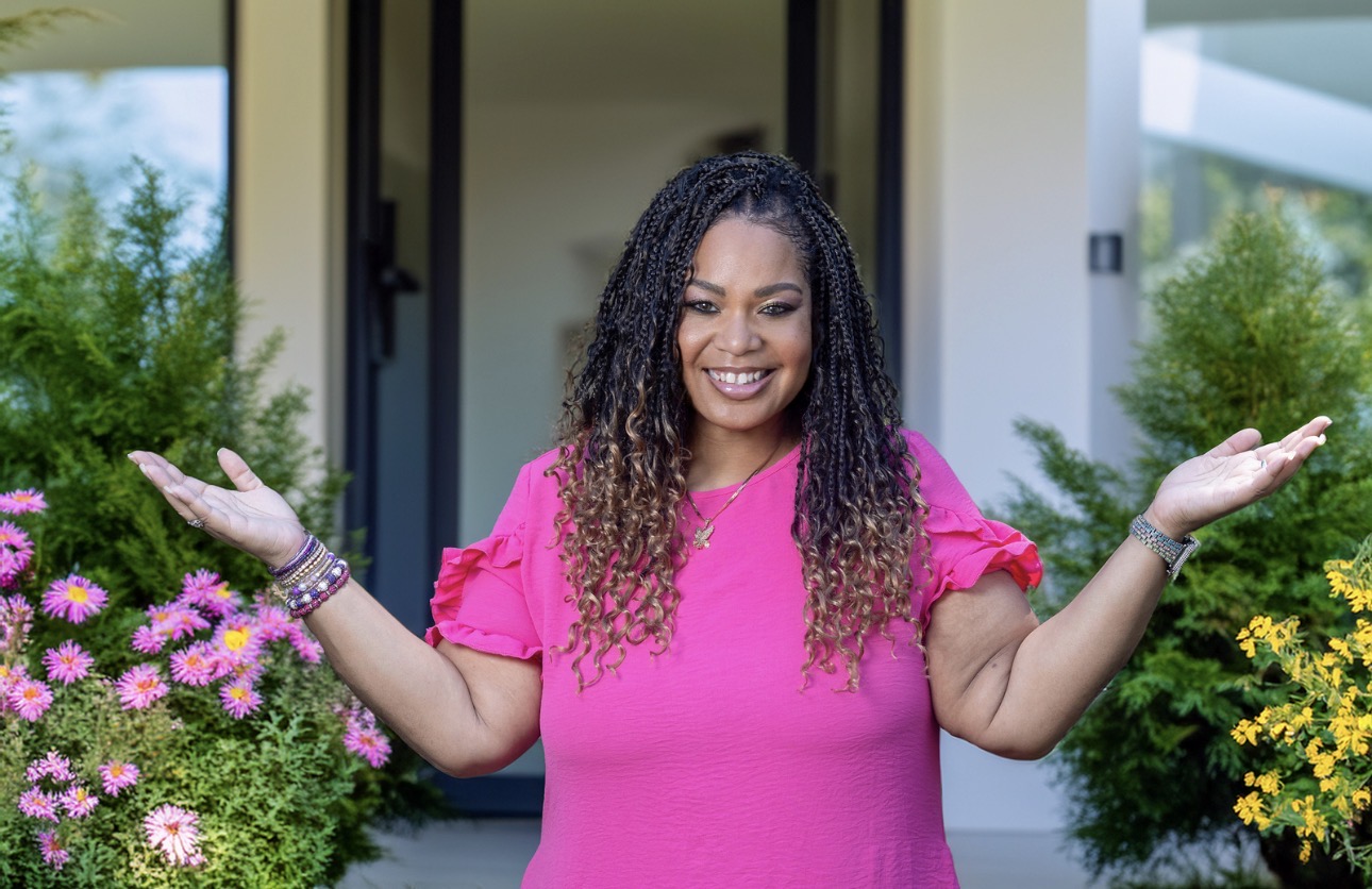Kanikashani Massey welcoming visitors to JOI at Home, LLC